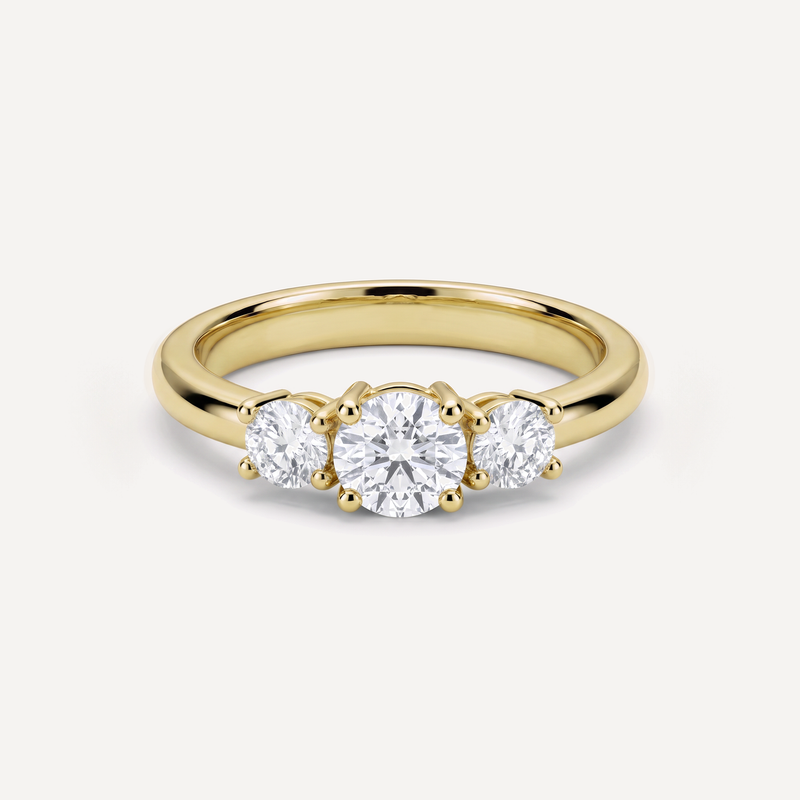 Flora tre-stens ring i guld set forfra